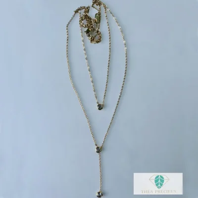 Collier en acier inoxydable très élégant. Double rangée d’une fine chaine avec strass et un pendant strass